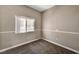 Bedroom featuring carpet, base trim, window, and light-colored walls at 9303 Gilcrease Ave # 2217, Las Vegas, NV 89149