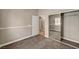 Neutral bedroom with mirrored closet doors and doorway to the ensuite bathroom at 9303 Gilcrease Ave # 2217, Las Vegas, NV 89149