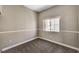 Bedroom featuring carpet, base trim, window, and light-colored walls at 9303 Gilcrease Ave # 2217, Las Vegas, NV 89149