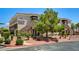 Exterior of a two story building with well maintained landscaping at 9303 Gilcrease Ave # 2217, Las Vegas, NV 89149