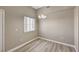 Neutral dining area with modern light fixture and wood-look floors at 9303 Gilcrease Ave # 2217, Las Vegas, NV 89149