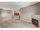 Open-concept living and kitchen area with modern floors and fireplace at 9303 Gilcrease Ave # 2217, Las Vegas, NV 89149