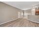 Bright, open-concept living space with wood-look flooring and neutral decor at 9303 Gilcrease Ave # 2217, Las Vegas, NV 89149