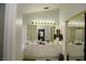 Bathroom featuring a double vanity with white countertops and a large mirror at 9440 Grenville Ave, Las Vegas, NV 89134