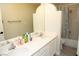 Bright bathroom with white vanity, dual sinks, and shower and tub combination at 9440 Grenville Ave, Las Vegas, NV 89134