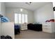 Neutral bedroom with plush carpet, a large window, and plenty of space at 9440 Grenville Ave, Las Vegas, NV 89134
