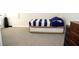 Bedroom featuring a trundle bed with a blue striped comforter and grey carpeting at 9440 Grenville Ave, Las Vegas, NV 89134