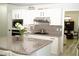 Bright kitchen features white cabinets, granite countertops, stainless steel appliances, and a large kitchen island at 9440 Grenville Ave, Las Vegas, NV 89134