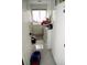 Efficient laundry room with white cabinets, a sink, a washer and dryer, offering convenience and functionality at 9440 Grenville Ave, Las Vegas, NV 89134