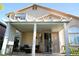 Covered patio featuring seating, metal security door, and view of the yard at 9440 Grenville Ave, Las Vegas, NV 89134