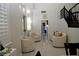 Sitting area featuring tile floors and three upholstered chairs at 9440 Grenville Ave, Las Vegas, NV 89134