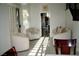 Sitting area featuring tile floors and three upholstered chairs at 9440 Grenville Ave, Las Vegas, NV 89134