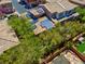 An aerial view shows the roof of this home with solar panels and a quaint backyard at 9975 Sand Key St, Las Vegas, NV 89178