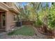 A charming outdoor space with mature landscaping, perfect for relaxation and entertaining at 9975 Sand Key St, Las Vegas, NV 89178