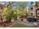 Backyard featuring an outdoor patio, hot tub, and privacy landscaping at 9975 Sand Key St, Las Vegas, NV 89178