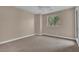 Spacious carpeted bedroom illuminated by natural light and a ceiling fan at 9975 Sand Key St, Las Vegas, NV 89178