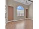 Light-filled bedroom with ceiling fan, large window, and neutral decor at 9975 Sand Key St, Las Vegas, NV 89178