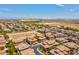 A stunning aerial view of the community, showcasing the desert landscape and mountain backdrop at 9975 Sand Key St, Las Vegas, NV 89178