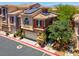 A beautiful townhouse with a two-car garage and solar panels on the roof at 9975 Sand Key St, Las Vegas, NV 89178