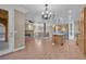 Spacious living room with wood floors, a fireplace, and seamlessly connected to the kitchen at 9975 Sand Key St, Las Vegas, NV 89178