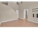 Open-concept living area with bright walls and access to stairs at 9975 Sand Key St, Las Vegas, NV 89178
