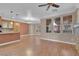 Open-concept living space with hardwood floors, fireplace, and natural light at 9975 Sand Key St, Las Vegas, NV 89178