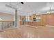 Spacious living area and kitchen featuring an island and stainless steel appliances at 9975 Sand Key St, Las Vegas, NV 89178