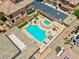 A luxurious community pool with sun loungers and a spa for relaxing in style at 9975 Sand Key St, Las Vegas, NV 89178