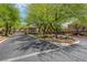 Beautiful street view, lined with lush trees and well-maintained landscaping at 9975 Sand Key St, Las Vegas, NV 89178