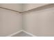 Walk-in closet with carpet flooring, a single shelf, and a hanging rod at 9975 Sand Key St, Las Vegas, NV 89178