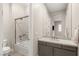 Clean bathroom featuring a shower-tub combo and modern vanity at 10482 Calico Terrace Ave, Las Vegas, NV 89135