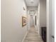 Hallway with wood floors, neutral paint, and a cabinet for storage at 10482 Calico Terrace Ave, Las Vegas, NV 89135