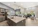 Open layout connecting the kitchen, dining, and living areas, ideal for modern living at 10482 Calico Terrace Ave, Las Vegas, NV 89135