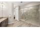 A walk-in shower with glass doors and tiled walls at 10482 Calico Terrace Ave, Las Vegas, NV 89135