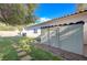 View of the backyard featuring a shed, manicured lawn, and concrete walkway at 10518 Santerno St, Las Vegas, NV 89141