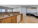 Open kitchen with stainless steel sink and views to breakfast nook at 10518 Santerno St, Las Vegas, NV 89141