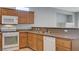 Well-equipped kitchen features wood cabinets and stone countertops at 10518 Santerno St, Las Vegas, NV 89141
