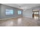 Spacious living room featuring tile flooring, neutral wall color, and great natural light at 10518 Santerno St, Las Vegas, NV 89141