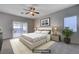 Serene main bedroom with sliding glass doors and ceiling fan at 10518 Santerno St, Las Vegas, NV 89141
