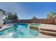 A swimming pool and spa in the backyard at 10518 Santerno St, Las Vegas, NV 89141