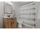 Cozy bathroom featuring a vanity, toilet, shower, and decorative mirror at 1417 Dogwood Ave, North Las Vegas, NV 89030