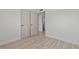 Clean bedroom with wood-look floors, an ensuite bathroom, and a closet at 1417 Dogwood Ave, North Las Vegas, NV 89030