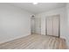 Neutral bedroom featuring wood-look floors, an ensuite bathroom, and a closet at 1417 Dogwood Ave, North Las Vegas, NV 89030
