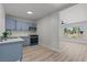 Updated kitchen with blue cabinets, sleek countertops, and stainless steel appliances at 1417 Dogwood Ave, North Las Vegas, NV 89030