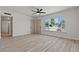 Spacious living room with laminate floors, neutral paint, and lots of natural light at 1417 Dogwood Ave, North Las Vegas, NV 89030
