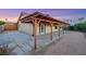 Back of home with covered patio and gravel landscaping at 160 Coastal Pier Ct, Henderson, NV 89002