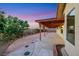 Backyard with covered patio, gravel, concrete and landscaping at 160 Coastal Pier Ct, Henderson, NV 89002