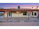 Rear view of home with covered patio supported by posts at 160 Coastal Pier Ct, Henderson, NV 89002