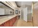 Spacious bathroom with dual sinks, granite counters, and a walk-in shower at 160 Coastal Pier Ct, Henderson, NV 89002