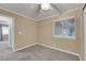 Bedroom with neutral carpet and a large window at 160 Coastal Pier Ct, Henderson, NV 89002